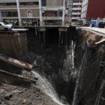 A massive sinkhole opens on Samsen Road near Vajira Hospital,