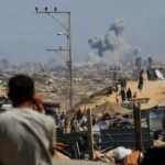 Smoke rises from an Israeli strike in the central Gaza