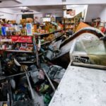 A damaged convenience store, after flooding brought by Super Typhoon