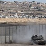 An Israeli tank manoeuvres on Israeli side of the Israel-Gaza