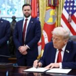 U.S. President Donald Trump signs executives orders at the White