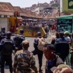 Malagasy police prepare to disperse protesters during a demonstration to