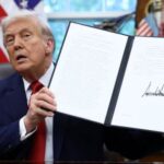 U.S. President Donald Trump signs executives orders at the White