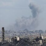 Smoke rises following an Israeli strike, as seen from the