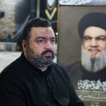 Jawad Nasrallah, son of late Hezbollah leader Hassan Nasrallah, sits