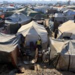 Displaced Palestinians shelter in tents