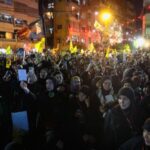 Hezbollah supporters gather at the site where the group’s late