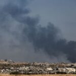 Smoke rises from Gaza after an explosion