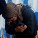 Mourners react during the funeral of Palestinians, at al-Awda Hospital
