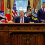 FILE PHOTO: U.S. President Donald Trump signs an executive order