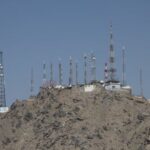 Telecom antennas stand on a mountain amid service shutdown across