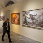 People visit an exhibition of North Korean art in Moscow