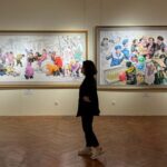 People visit an exhibition of North Korean art in Moscow