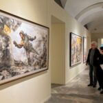 People visit an exhibition of North Korean art in Moscow