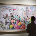 People visit an exhibition of North Korean art in Moscow