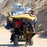Displaced Palestinians flee northern Gaza due to an Israeli military