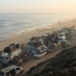 FILE PHOTO: Displaced Palestinians move southward after Israeli forces ordered