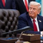 U.S. President Donald Trump signs an executive order in the