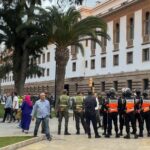 Anti-riot security personnel stand guard near the parliament, to prevent