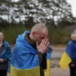 Ukrainian prisoners of war (POWs) gather after a swap at