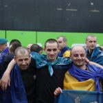 Ukrainian prisoners of war (POWs) gather after a swap at