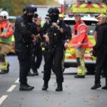 Emergency personnel work at the scene following an incident outside