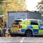 Emergency personnel work at the scene following an incident outside