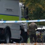 Emergency personnel work at the scene following an incident outside