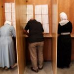 Members of electoral colleges gather to vote for selecting their