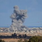 Smoke rises from explosions in Gaza, as seen from southern