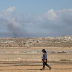 Smoke rises from explosions in Gaza, as seen from southern