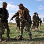 FILE PHOTO: Ukrainian service members attend a military drill near