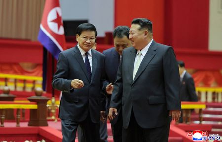 North Korean leader Kim Jong Un meets with Laotian President