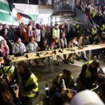 Greta Thunberg and activists from the Global Sumud Flotilla hold