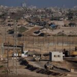 Israeli military vehicles manoeuvre near the Israel-Gaza border