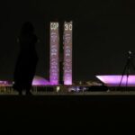 Slogans designed by Greenpeace activists are projected onto the Brazilian