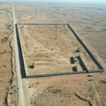 A drone view shows the site of a mass grave