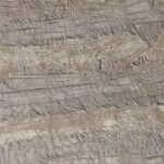A drone view of imprints, made by bulldozer tracks, on