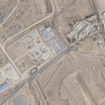 A satellite view shows trucks carrying humanitarian aid lined up