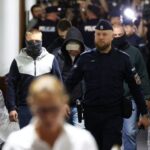 Volodymyr Z. walks escorted by Polish Police at the district