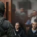 Members of Ukraine’s Aidar Battalion attend a court hearing in