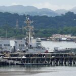 FILE PHOTO: U.S. Navy guided missile cruiser docks at a