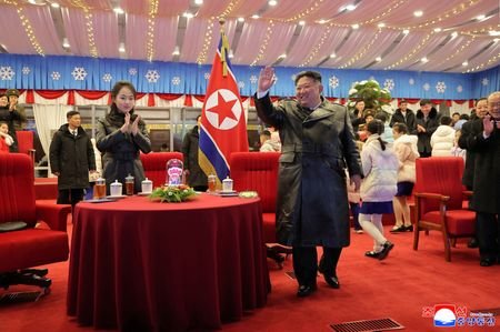 North Korean leader Kim Jong Un attends an event to