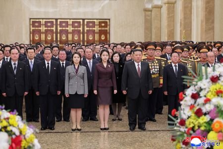 North Korean leader Kim Jong Un attends an event to