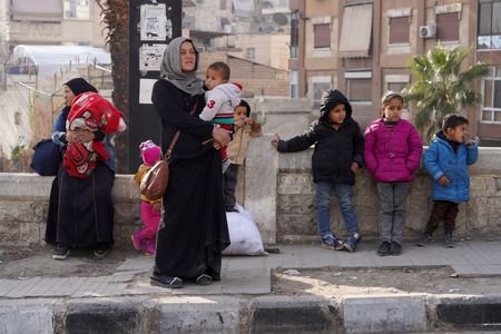 Civilians flee following renewed clashes between the Syrian army and
