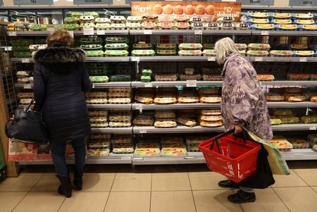 Customers shop at a supermarket in Budapest