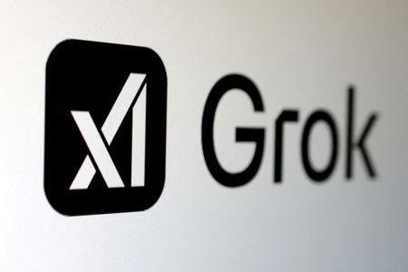 FILE PHOTO: Illustration shows xAI and Grok logos