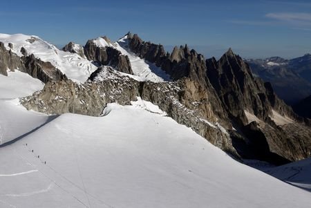FILE PHOTO: Alpinists make their way across a glacier on
