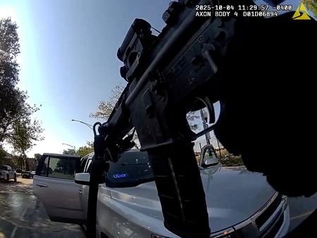 U.S. Border Patrol officer hold his weapon after a collision