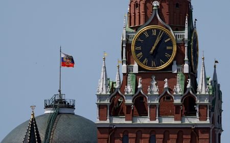 The Russian flag flies on the dome of the Kremlin